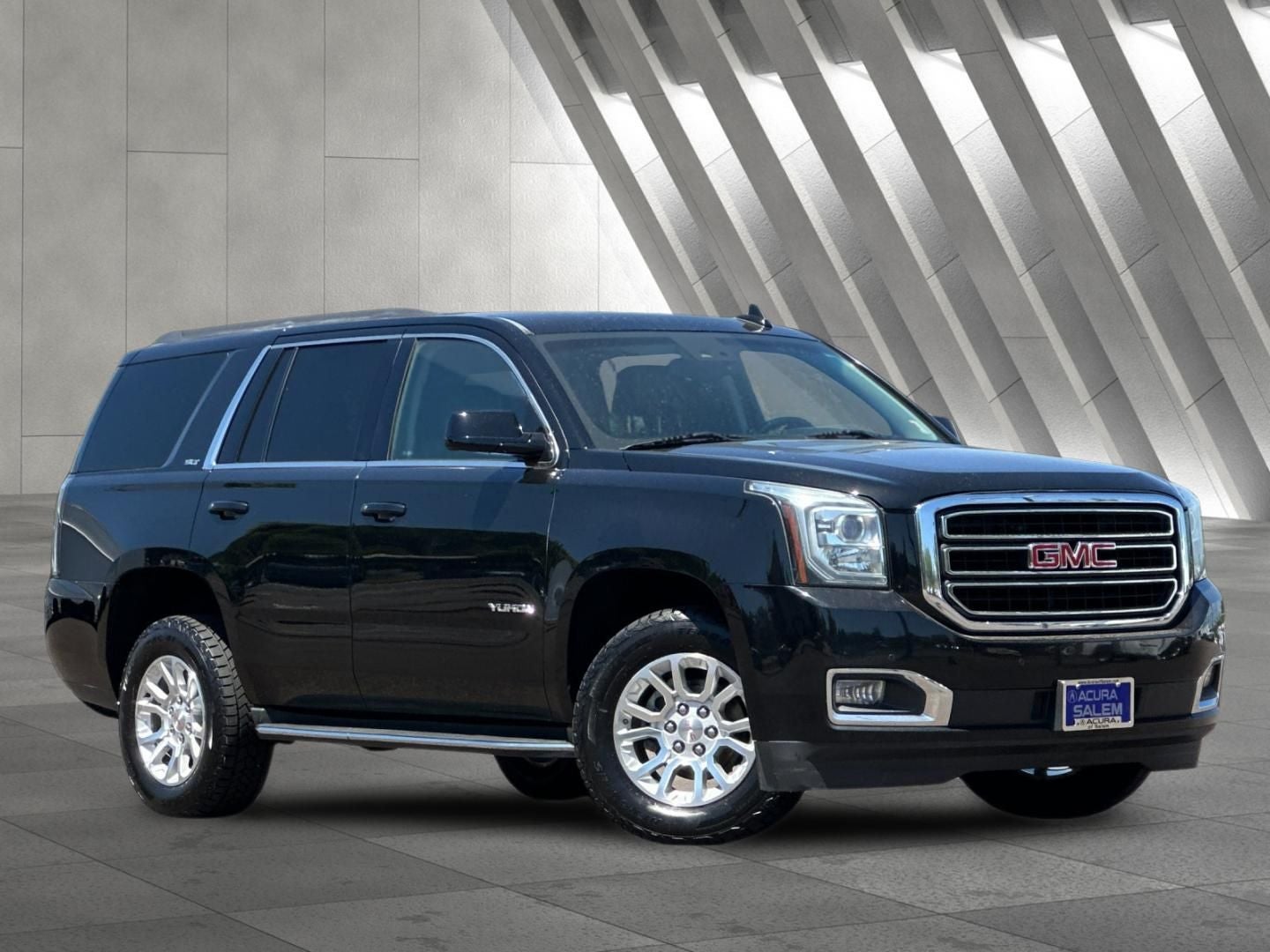 2017 GMC Yukon SLT in Onyx Black — front three-quarter view