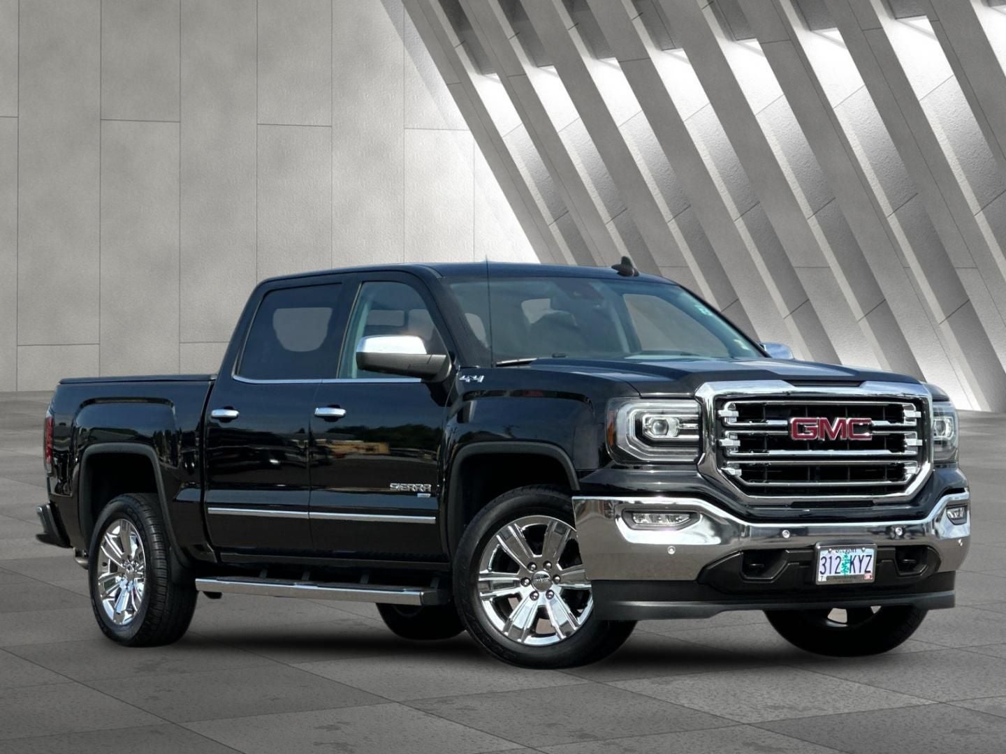 2018 GMC Sierra 1500 SLT in Onyx Black — front three-quarter view