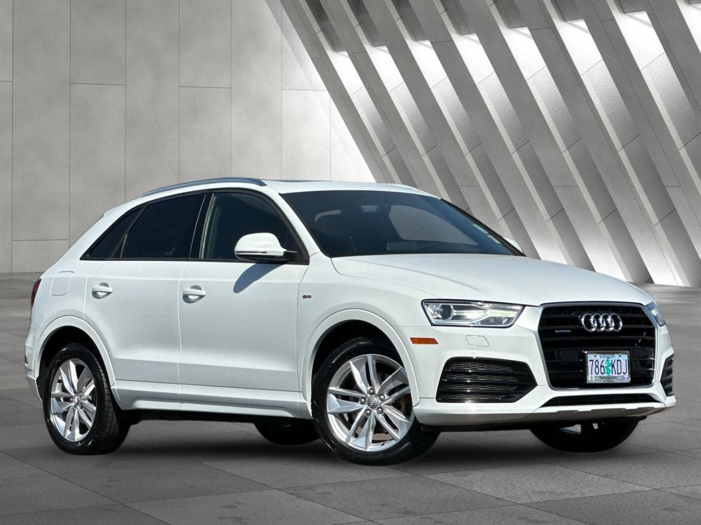 2018 Audi Q3 2.0T Premium quattro in Glacier White — front three-quarter view