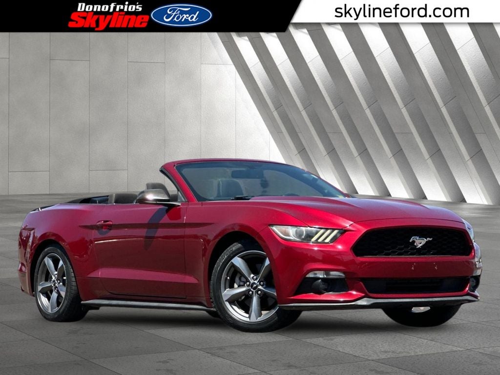2016 Ford Mustang V6 in Ruby Red Metallic — front three-quarter view