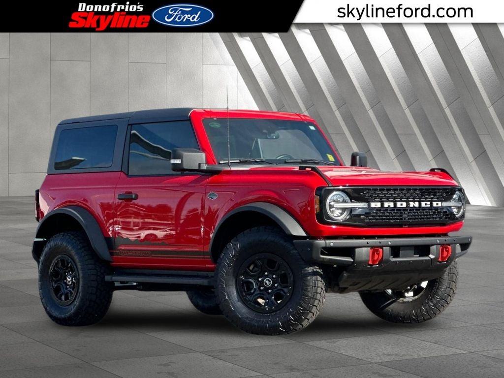 2022 Ford Bronco Wildtrak in Race Red — front three-quarter view