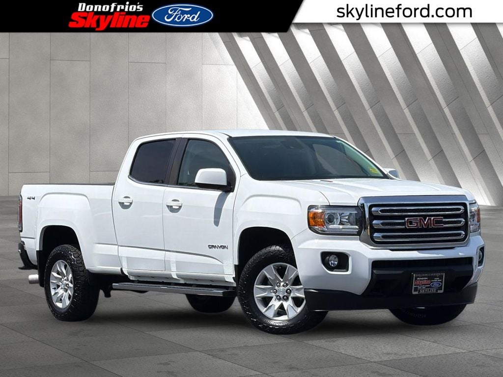 2018 GMC Canyon SLE1 in Summit White — front three-quarter view