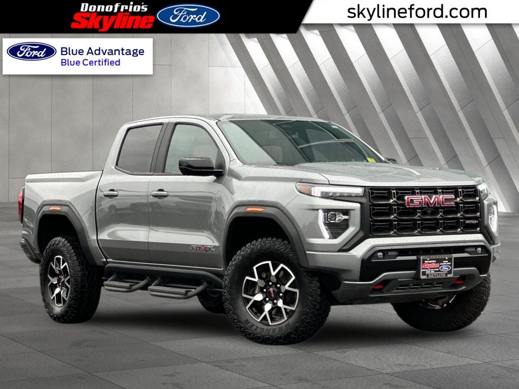 2024 GMC Canyon AT4X in Sterling Metallic — front three-quarter view