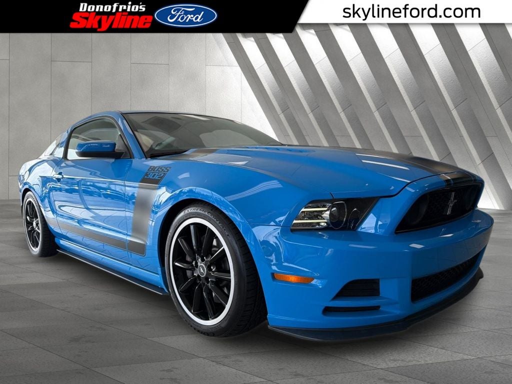 2013 Ford Mustang Boss 302 in Grabber Blue — front three-quarter view